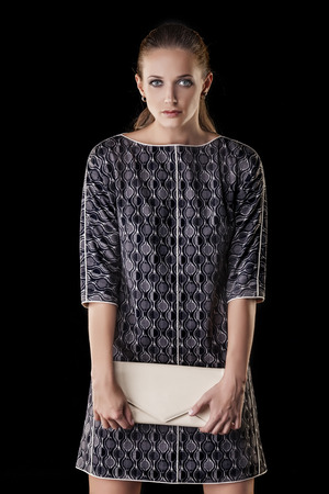 Model beautiful women in fashionable clothes and accessories shot isolated on a black background in the Studioの写真素材
