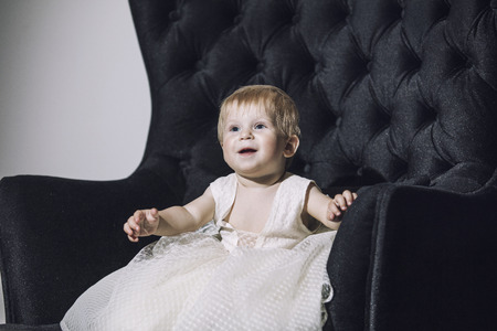 Baby girl little very trendy and stylish dressed beautiful cute and happy in the room