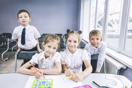 Beautiful children are students together in a classroom at the school receive education happyの写真素材