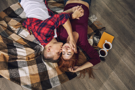 Young adult beautiful couple in love man and woman together at home happy and beautiful