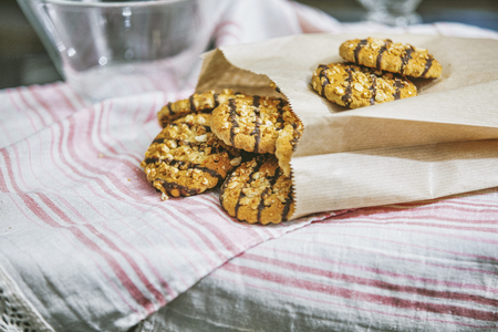 Oatmeal healthy and delicious homemade cookies lie on the table in the kitchen close-up