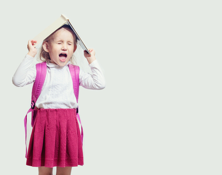 Little child girl beautiful fashionable and happy on isolated background, back to schoolの写真素材