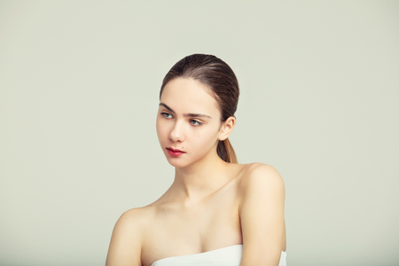 Model beautiful young girl with blond hair and blue eyes fashionable portrait in the Studioの写真素材