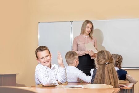 Beautiful children are students together in a classroom in school get the education with the teacherの写真素材