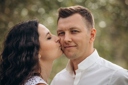 Beautiful happy couple in love man and woman, portrait in nature close-upの写真素材