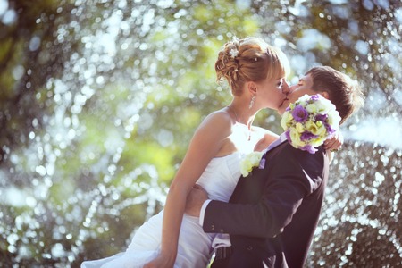 Wedding kiss in the rainの写真素材
