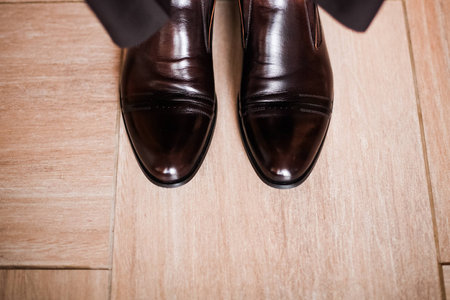 Shoes black the groom on a wooden floor 1の写真素材