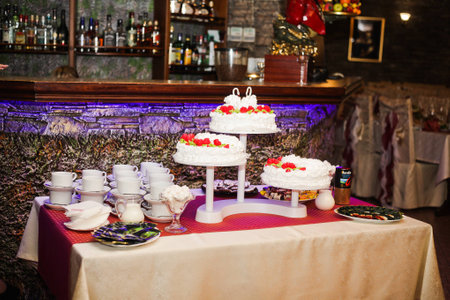 White wedding cake on the tea table with bar 1の写真素材