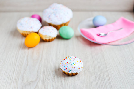 The Easter cake and colourful  eggs on a tableの写真素材