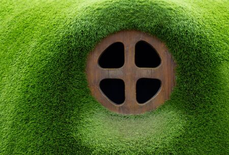 An unusual wooden window is like a window to a fairy-tale worldの写真素材