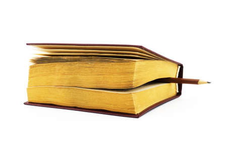 Isolated photo of an book with pencil as bookmarkの写真素材