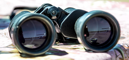 Binoculars on the tableの写真素材