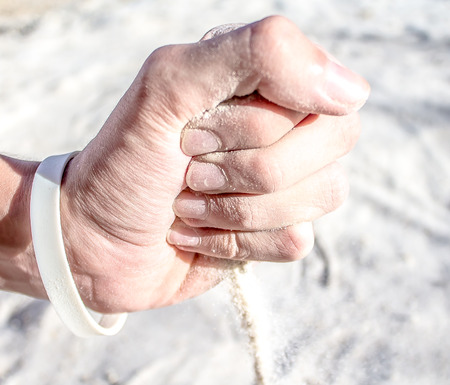 White quartz sand in handの写真素材