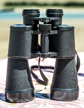 Binoculars on the tableの写真素材