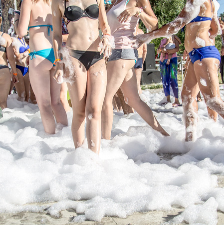 People in foam at a foam partyの写真素材