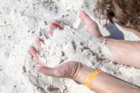 White sand in the handsの写真素材