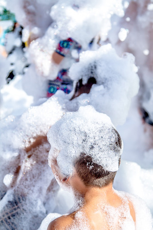 People in foam at a foam partyの写真素材