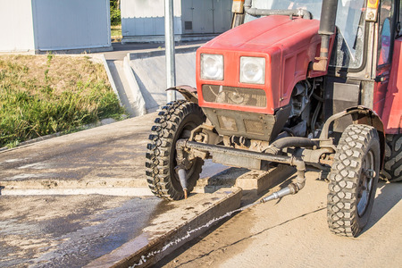Tractor washes road in the cityの写真素材