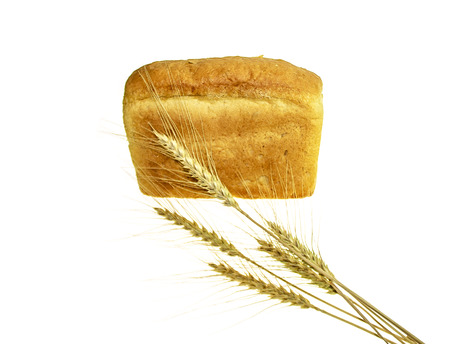 Wheat ears and bread on white backgroundの写真素材
