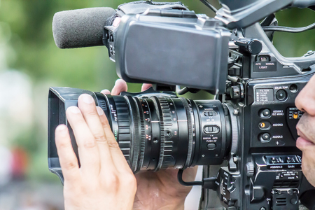 A man shoots on a video camera