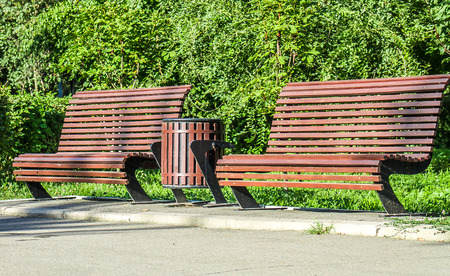 Bench and urn in the parkの写真素材