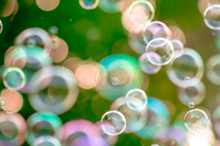 Soap bubbles in nature as a background blur