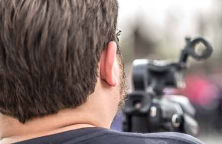 Man with video cameraの写真素材