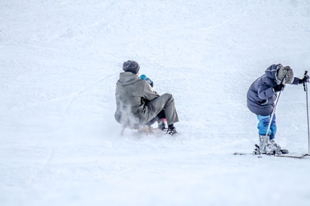 Sledding from the mountainside at the ski resortの写真素材
