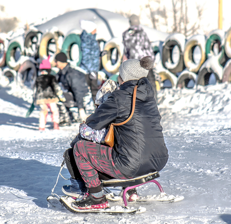 Sledding from the mountainside at the ski resortの写真素材