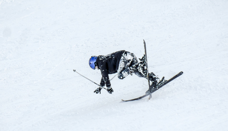 The fall of the skier in the snowの写真素材