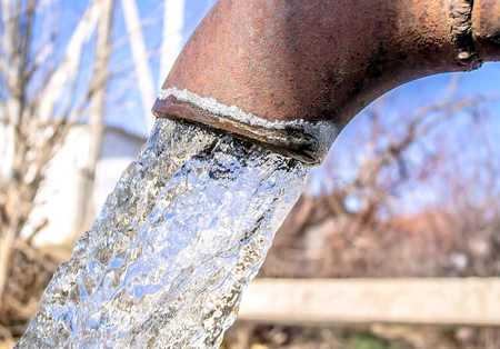 Water flow from the pipeの写真素材