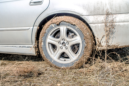 Wheel of a car in the mudの写真素材