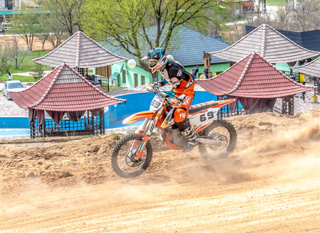 Shymkent, Kazakhstan, April 1, 2018; Open Cup of South Kazakhstan region on the motorcycle cross for the prize "Ainabulak". Spectators and participants in the motocross competition.のeditorial素材