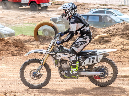 Shymkent, Kazakhstan, April 1, 2018; Open Cup of South Kazakhstan region on the motorcycle cross for the prize "Ainabulak". Spectators and participants in the motocross competition.のeditorial素材