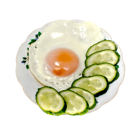 Fried eggs on a plate on a white backgroundの写真素材