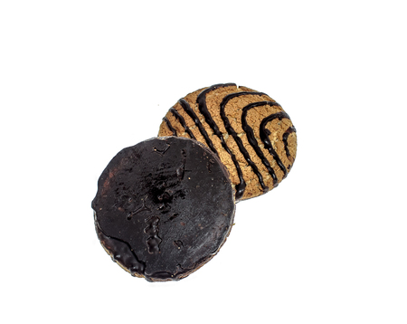 Oatmeal cookies in chocolate on a white backgroundの写真素材