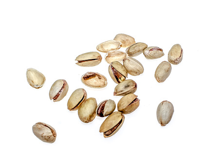 Salted pistachio nuts on white backgroundの写真素材