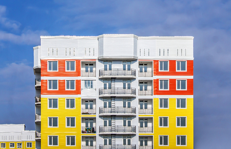 Bright high-rise house against the sky as a backgroundの写真素材