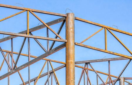 Rusted metal structures on the sky background