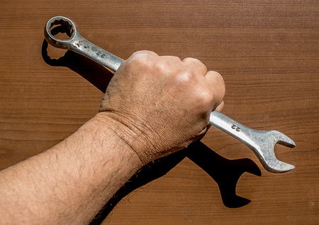 Wrench in handの写真素材