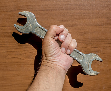 Wrench in handの写真素材