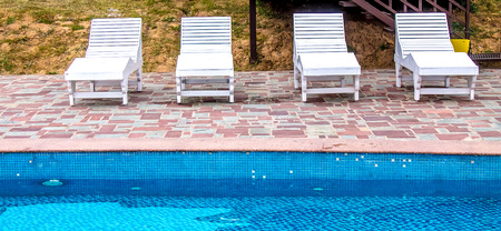 Swimming pool with blue water and stairs