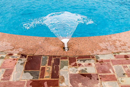 Water fountain in the poolの写真素材