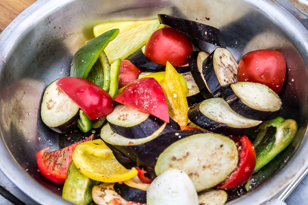 Sliced vegetables in a basinの写真素材
