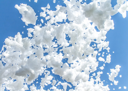 Foam against the blue sky as an abstract background