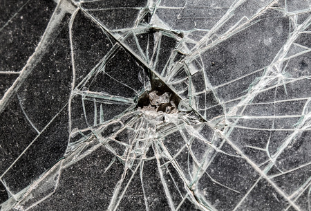 Broken dirty car windshield as background