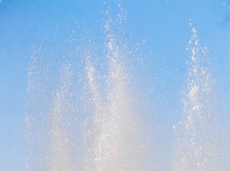 The fountain splashes against the skyの写真素材