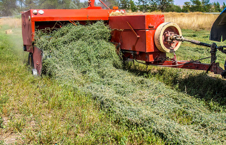 Hay Collecting equipment on the fieldの写真素材