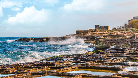 Sea waves and coastal stones seascape as backgroundの写真素材