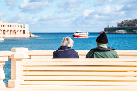 Tourists on the beach visiting the sights of Maltaの写真素材